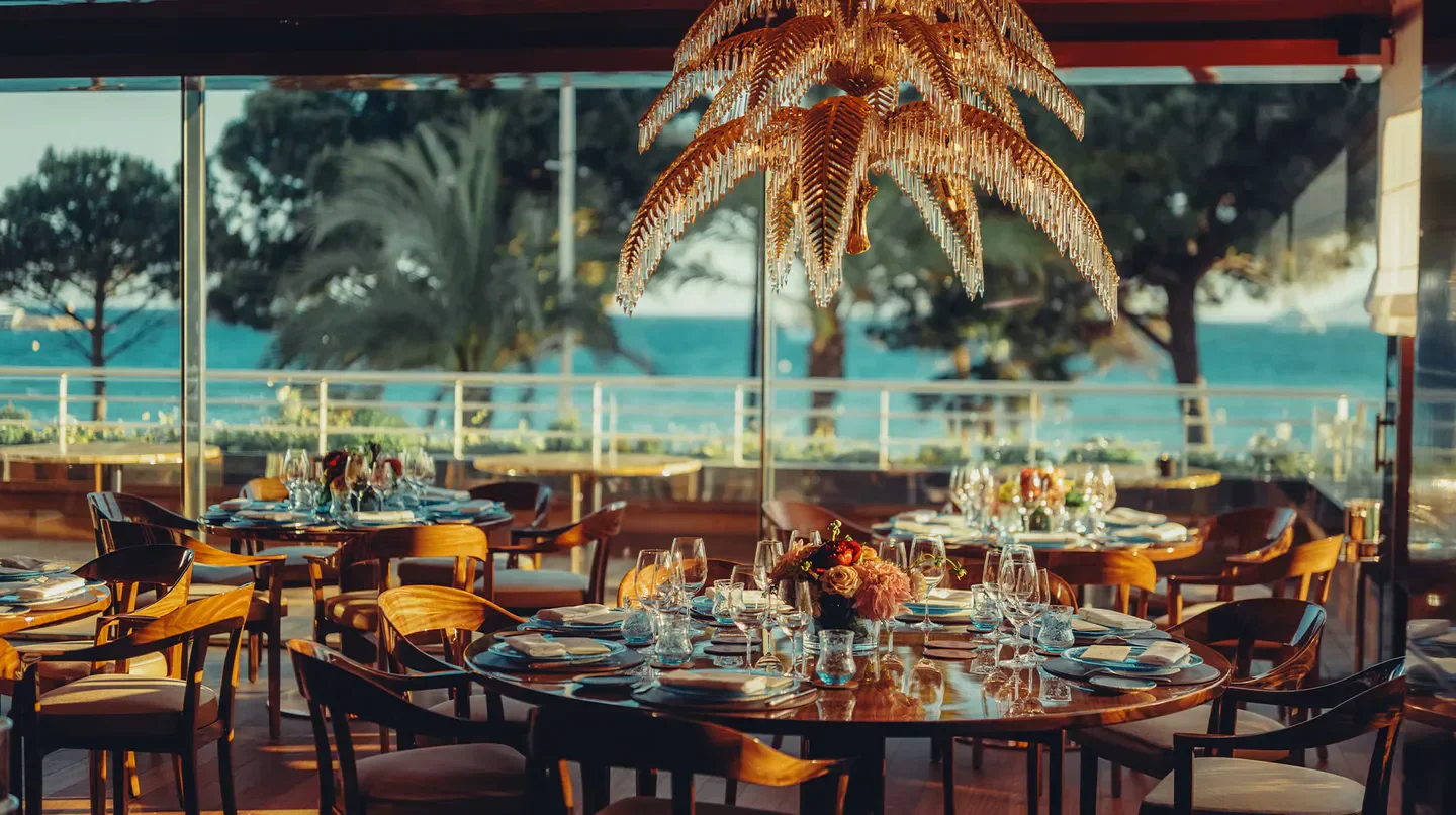 Dining room at Hôtel Martinez in Cannes, featuring sea views and elegant decor