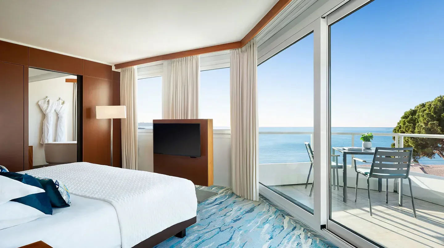 JW Marriott Cannes hotel room with a balcony overlooking the sea in Cannes, France.
