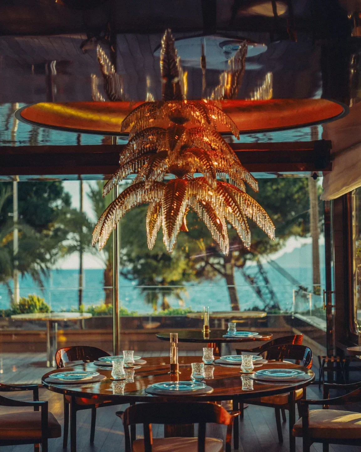 Elegant dining at La Plage du Martinez restaurant in Cannes with ocean views.