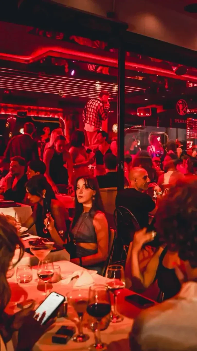 Inside Le Speakeasy nightclub in Cannes, with people enjoying the ambiance.
