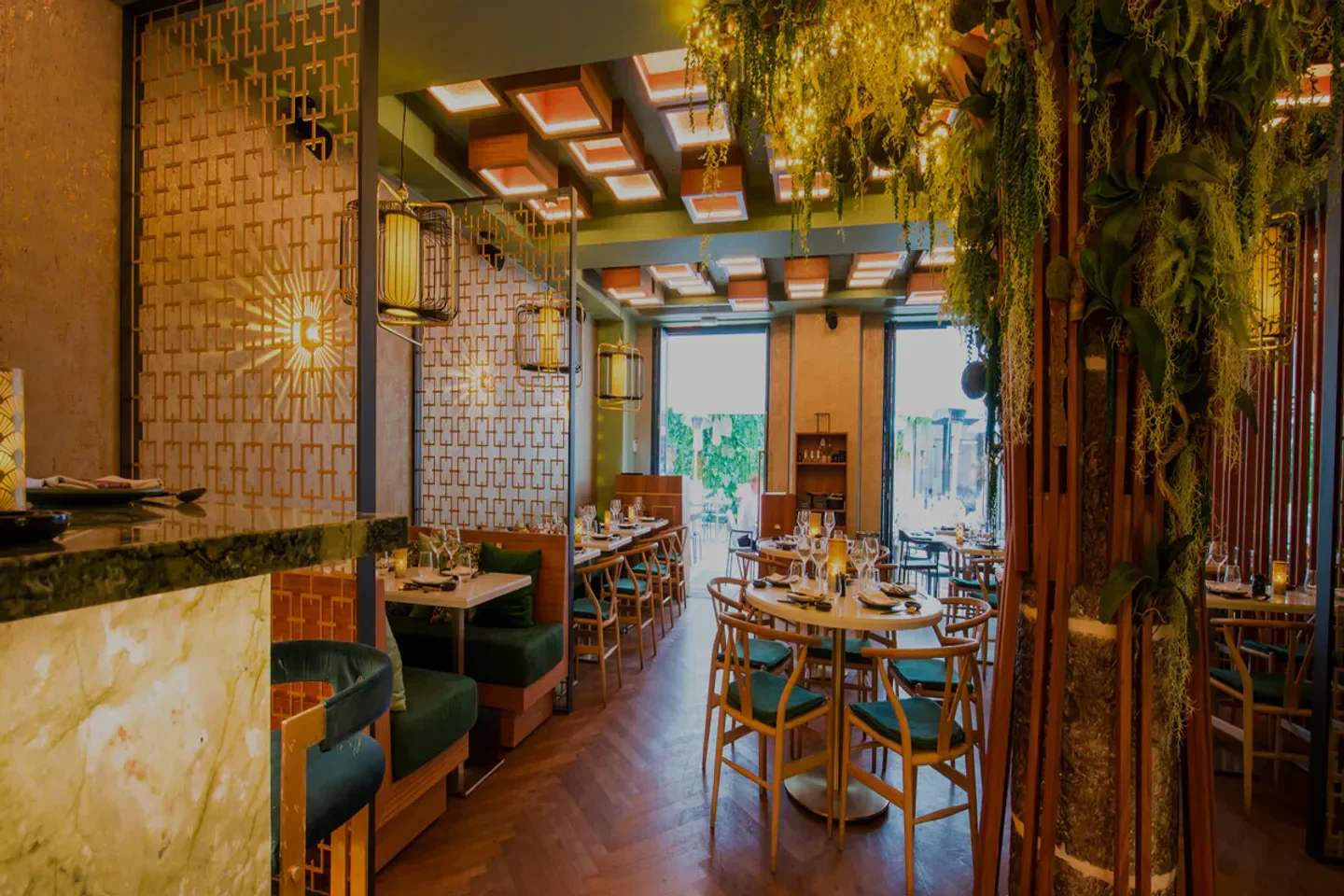 Interior of Mido restaurant in Cannes, with stylish decor and unique lighting.