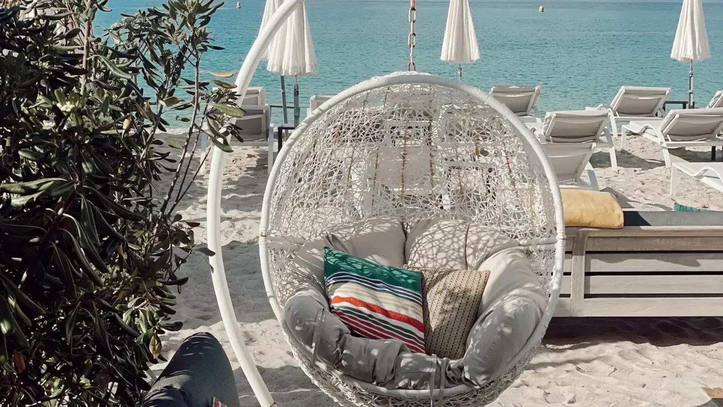 Relaxing outdoor seating at Rado Beach Helen in Cannes, France, overlooking the ocean